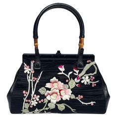 Tom Ford For Gucci Black Silk Frame Japanese Flowers Bag S/S 2003 Collection, Rare And Collectible. N 112528 204990 Colors – Black; Silk, Leather, Bamboo. Floral Japanese Embroidery In White, Pink, Red, Green On Both Sides Leather Side Panes, Frame-shaped Opening, Signature Bamboo Handles. Matte Black Hardware, Brown Leather Interior, One Zip Pocket. 14” Width X 10.5” Height X 4.5” Depth Made in Italy. Excellent condition. Formal Black Shoulder Bag With Bamboo Handle, Elegant Black Shoulder Bag With Bamboo Handle, Tom Ford For Gucci, Tom Ford Gucci, Tom Ford Bag, Japanese Clothes, Japanese Bag, Gucci Brand, Matte Black Hardware