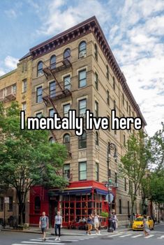 people crossing the street in front of a tall building that says i mentally live here