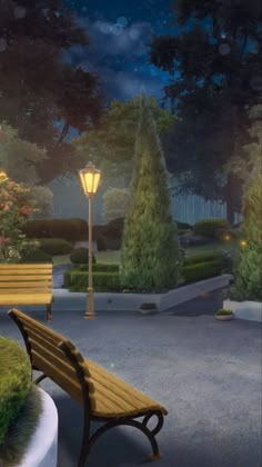 a park bench sitting in front of a lamp post at night with trees and bushes