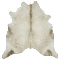 a white and brown cowhide rug on a white background