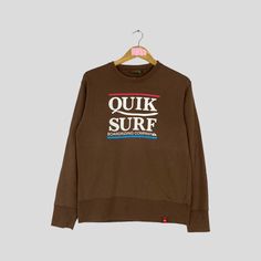 Vintage Rare QUIKSILVER Crewneck Sweatshirt Big Logo QUIKSLILVER Surf Jumper Pullover QUIKSILVER Sweater Brown Colour Unisex Medium Size CONDITION :- ✅GOODUSED CONDITION. ✅NO STAINS  ✅NO HOLE ITEM DESCRIPTION:- ✅SIZE: M ✅MATERIAL : COTTON ✅THIS USED & VINTAGE ITEMS, SO DON'T EXPECTED IT TO BE LIKE NEW CONDITION!! MEASUREMENT:- ✅ARMPIT TO ARMPIT : 19 INCH ✅LENGHT BACK COLOR/NECK TO HEM : 25 INCH ✅SHOWLDER : 18 ✅SLEEVE LENGTH: 22.5 INCH PLEASE REFER PHOTO BEFORE ORDER ALL MEASUREMENTS ARE TAKEN WI Brown Cotton Crew Neck Sweater, Brown Long Sleeve Sporty Tops, Sporty Brown Long Sleeve Tops, Brown Crew Neck Sweater For Streetwear, Brown Long Sleeve Top With Graphic Print, Brown Crew Neck Sweatshirt For Loungewear, Brown Long Sleeve Casual Sweatshirt, Brown Graphic Print Crew Neck Sweatshirt, Brown Crew Neck Sweatshirt With Graphic Print