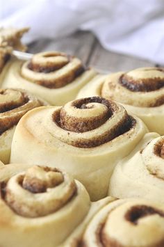 some cinnamon rolls are sitting on a tray