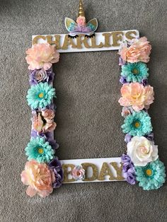 a photo frame decorated with flowers and the words happy birthday