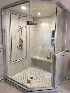 a walk in shower sitting inside of a bathroom