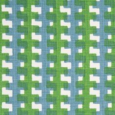 a green and blue fabric with white squares on it