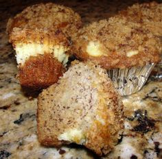 three muffins sitting on top of a marble counter