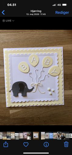 a card with an elephant on it and balloons in the shape of a heart is shown