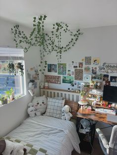 a bed room with a neatly made bed next to a window and a computer desk