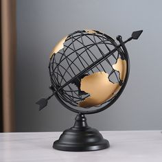 This exquisitely crafted metal globe is sure to add energy to your room and is a great choice for home decor and gifts. The abstract globes have become scientific icons with delicate rings and lovely forms. Any space will benefit from the addition of a metal tabletop globe. It is not only an elegant decoration, but also can be used as a collection or gift to family and friends, it will bring unexpected surprises. Gold Rugs, Travel Decorations, Modern Gold Kitchen, Rectangle Living Room, Geometric Kitchen, Modern Rug Runner, Gold Globe, Globe Ornament, Bath Mat Sets