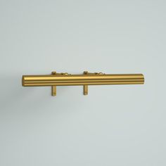 an image of a gold door handle on a white wall