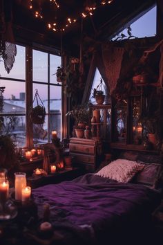 a bedroom with lots of candles and plants on the window sill next to it