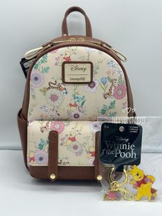 Loungefly Disney Winnie the Pooh Floral Allover Print Mini Backpack Set Set includes 1 mini backpack and 1 keychain Brand New with Tag NWT *Please see pictures for details* *Pattern may vary** Backpack Details: Polyurethane; polyester Approx. 7 1/2" W x 10" H x 4" D Keychain details: Metal; enamel Approx. 2 1/2" I will ship this item in a box with bubbles or paper. I put this item in a poly bag to keep it clean I will not responsible for shipment handling or damages by the carriers. However, I will pack your item with care. :) Feel free to message me for bundle or set :) NO cancellation or return. All sales are final. Cute Winnie The Pooh, Backpack Set, Loungefly Disney, Pooh Bear, Disney Winnie The Pooh, Poly Bags, Mini Backpack, In A Box, Keep It Cleaner