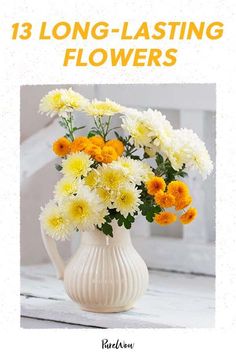 a white vase filled with yellow and white flowers