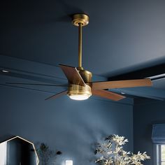 a ceiling fan that is hanging from the ceiling in a room with blue walls and furniture