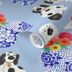 a blue and white wallpaper with dogs, flowers and vases on the ground