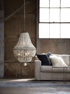 Classic style meets modern charm with this chandelier. A bevy of draped wooden beads in weathered white, dresses up the steel structure, bringing out an earthy glamour to any space. Dimensions: 37.5H x 20.5W X 20.5D Max Height: 111 Canopy: 5 x 5 x 1 UL Rating: Dry Wattage: 40 Watt Max Bulb Qty: 6 Bulb Type: B Type Candelabra Base (E12) Socket: E12 Candelabra Wiring Type: Hard Wire Chain: 6 ft. Cord: 10 feet Sloped Ceiling Compatible: Yes Material: Birch Wood Finish: White Weight: 28 Care Instruc Wooden Bead Chandelier, Wood Bead Chandelier, Blue Chandelier, Weathered White, 3d Modelle, White Chandelier, Beaded Chandelier, Chandelier For Sale, Burke Decor