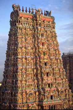 an elaborately decorated tower in the middle of a city