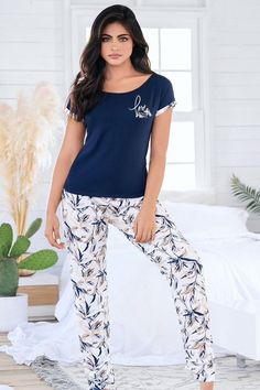 This Long PJ Set is perfect for those who appreciate comfort without compromising on style. Made from soft and stretchy cotton fabric, this set includes a short-sleeve t-shirt with printed cuffs and a loose fit for ultimate relaxation. The matching straight boot trousers feature an elastic waistband for a perfect fit. The set comes in a beautiful blue colors with a printed message on the shirt, adding a touch of inspiration and positivity to your loungewear collection. Whether you're looking for Comfortable Short Sleeve T-shirt For Lounging, Casual Stretch Sleepwear With Letter Print, Printed Cotton Crew Neck Sleepwear, Crew Neck Cotton Printed Sleepwear, Blue Cotton Sleepwear With Letter Print, Summer Cotton T-shirt For Lounging, Cotton Graphic Print Tops For Lounging, Stretch Cotton Short Sleeve Sleepwear, Stretch Cotton Sleepwear With Short Sleeves