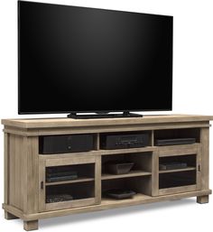 a flat screen tv sitting on top of a wooden entertainment center