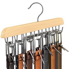 a wooden hanger with six different colors of leathers hanging from it's hooks