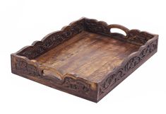 an old wooden tray with carvings on the bottom and sides, isolated against a white background