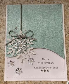 a christmas card with a snowflake on it