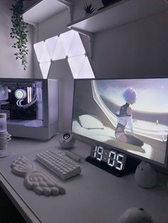 two computer monitors sitting on top of a desk