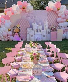 a table set up for a princess party with pink chairs and balloons on the wall