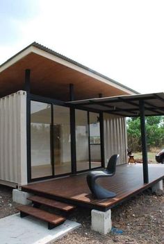 a small house made out of shipping containers