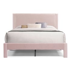 a bed with pink upholstered headboard and two pillows on top of it