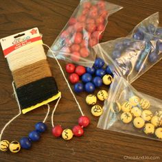 two bags of beads and some other items on a table