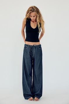 Pants with a mid waist and belt loops. Adjustable elastic waistband with self-drawstring. Front pockets and back patch pockets. Front zip and metal hook closure. Fire Fits, Fashion Icon, Skorts