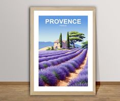 a lavender field with a house and trees in the background, framed on a wall