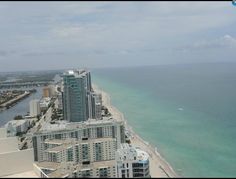 an aerial view of the beach and ocean from a high rise building in miami, florida