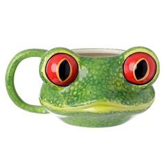 a green frog mug with red eyes on it's face and two large orange eyes