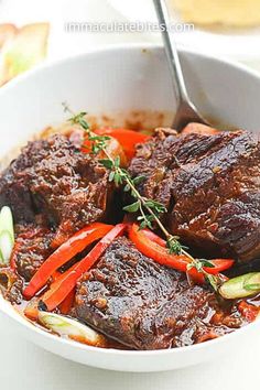 Jamaican Braised Stew Beef Ribs - If you want something that is bad to the bone, finger licking good, insanely delicious, impossible to mess up, with very little prep then this is it!!!

You only need 10 minutes prep to make this rich, fragrant, braised short ribs stew and its fall off the bone delicious!

Hop on to immaculatebites for more Caribbean recipes, beef Jamaican recipes, dinner ideas, dinner recipes. Jamaican Short Ribs, Jamaican Short Ribs Recipe, Jerk Beef Short Ribs, Jamaican Jerk Beef Short Ribs, Jamaican Beef Recipes, Beef Short Ribs Stew, Short Ribs Stew, Beef Rib Stew, Jamaican Beef Stew