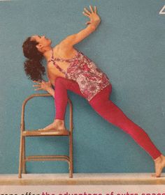 a woman standing on top of a chair in front of a wall with the words dance after the abundance of every space