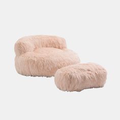 a pink furry chair and footstool on a white background