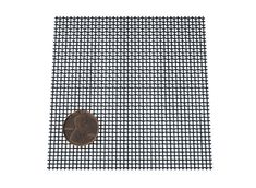 a piece of metal mesh with a penny on it