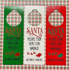 three door hangers that say santa please stop here for naale and will have cookies