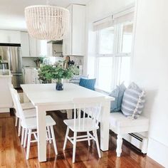 a white table and chairs in a room