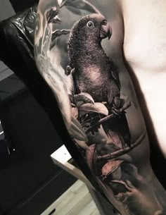 a man's arm with a bird on it