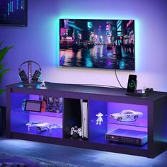 an entertainment center with video game controllers on it