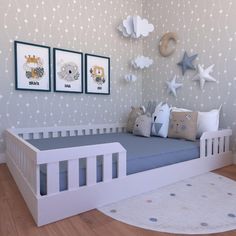 a child's bedroom with blue bedding and stars on the wall behind it