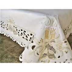 a white table cloth with an intricate design on it