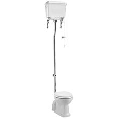 a white toilet sitting next to a metal pole