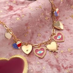 Immerse yourself in the eccentric charm of the Heart Evil Eye Charm Necklace, a standout piece from our "Powerful and Unconstrained Style" collection, straight out of a scene from a whimsical period piece. Picture this: an exquisite heart-shaped pendant, rendered in 18K gold-plated brass, is adorned with a bewitching evil eye motif. The necklace is meticulously detailed with a cascade of dripping oil and a sprinkling of cubic zirconia, adding a dash of cinematic sparkle. This charm necklace is n Valentine's Day Symbolic Heart-shaped Jewelry, Heart-shaped Dangling Charms Jewelry For Valentine's Day, Heart-shaped Jewelry With Dangling Charms For Valentine's Day, Valentine's Day Symbolic Necklaces With Heart Pendant, Valentine's Day Symbolic Jewelry With Heart Charm, Valentine's Day Heart Charm Symbolic Jewelry, Symbolic Heart Charm Necklace For Valentine's Day, Valentine's Day Heart Pendant Charm Necklaces, Symbolic Heart-shaped Charms Jewelry