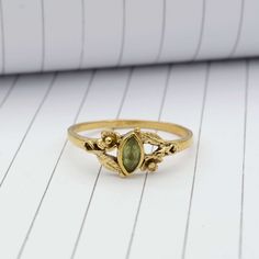 Product:-Ring Material:- Brass Size:- All size available Gemstone:- Peridot    Peridot Leaf Ring, Gold Ring, Wedding Ring ,Flower Ring, Stacking Ring,Marquise Cut Ring ,Peridot Ring,Boho Ring ,Minimal Ring,Promise Ring, ❥ Customers' satisfaction is our biggest priority, please contact us with any questions/queries for future or existing orders, and we will do our best to make sure you are happy with your order. ❥Please make sure to add the correct address during checkout. You can return your purchased item within 15 days after successful delivery. We offer a 100% "Money Back Guarantee" if you are not satisfied with your purchase. ❥If you are not satisfied with your purchased items then contact with us first before leaving negative or neutral feedback or opening disputes. We believe in solv Green Opal Ring, Mushroom Engagement Ring, Handmade Green Brass Rings, Bohemian Gold Rings With Birthstone, Bohemian Birthstone Crystal Ring For Promise Occasions, Bohemian Green Rings For Anniversary, Bohemian Green Birthstone Ring, Bohemian Green Wedding Rings, Bohemian Green Flower Ring For Gift