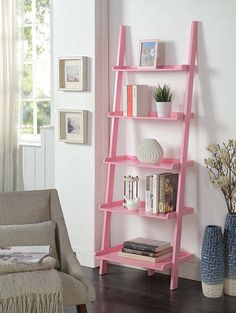 a pink leaning shelf with books on it