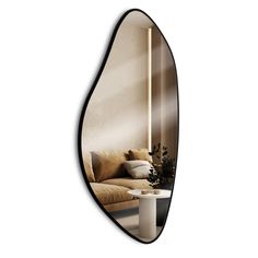 an oval mirror reflecting a couch and table